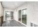 Covered balcony featuring tiled floors and sliding glass doors leading to the interior at 3470 S Poplar St # 401, Denver, CO 80224