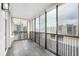 Enclosed balcony featuring tiled floors and floor-to-ceiling windows with scenic views at 3470 S Poplar St # 401, Denver, CO 80224
