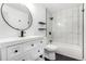 Modern bathroom showcasing sleek fixtures, tiled shower, and a vanity with storage at 3470 S Poplar St # 401, Denver, CO 80224