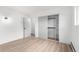 Bright room with a large closet and modern light fixture at 3470 S Poplar St # 401, Denver, CO 80224