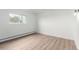 Bright bedroom space with neutral walls and a window with outside light at 3470 S Poplar St # 401, Denver, CO 80224