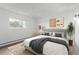 Cozy bedroom with a plush bed, neutral decor, and a bright window at 3470 S Poplar St # 401, Denver, CO 80224