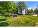 Morningside Condominiums surrounded by lush green lawn and mature trees on a sunny day at 3470 S Poplar St # 401, Denver, CO 80224