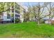 Well-maintained building with lush lawn and mature trees offers curb appeal and green space at 3470 S Poplar St # 401, Denver, CO 80224