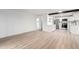Open living space with white walls and cabinets adjacent to the kitchen, stainless steel appliances at 3470 S Poplar St # 401, Denver, CO 80224