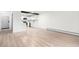 Bright and open living space with modern finishes, flowing into a kitchen with white cabinets at 3470 S Poplar St # 401, Denver, CO 80224