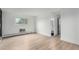 Spacious room with bright window and a entrance to a modern bathroom at 3470 S Poplar St # 401, Denver, CO 80224