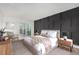 Modern bedroom with a slider that brings in natural light and calming wall decor at 3470 S Poplar St # 401, Denver, CO 80224