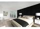 Staged main bedroom featuring balcony access at 3470 S Poplar St # 401, Denver, CO 80224