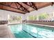 Indoor swimming pool with ample natural light and poolside seating at 3470 S Poplar St # 401, Denver, CO 80224