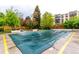 Community pool covered for the off-season with common outdoor grilling and picnic area nearby at 3470 S Poplar St # 401, Denver, CO 80224