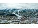 Picturesque aerial view of the neighborhood with snow-covered mountain peaks in the background at 62 Broken Lance Dr # 202E, Breckenridge, CO 80424