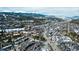Breathtaking aerial view of the town with stunning mountain backdrop, lush trees, and roadways winding throughout at 62 Broken Lance Dr # 202E, Breckenridge, CO 80424