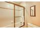 Bathroom features a glass enclosed shower and a small window for natural light at 62 Broken Lance Dr # 202E, Breckenridge, CO 80424