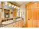 Well-appointed bathroom featuring double sinks, granite countertops, and ample storage at 62 Broken Lance Dr # 202E, Breckenridge, CO 80424