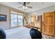 Bright bedroom with a large window, cozy decor, and access to an en-suite bathroom at 62 Broken Lance Dr # 202E, Breckenridge, CO 80424