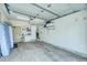 Spacious garage with ample storage shelving, white refrigerator, and plenty of open area at 62 Broken Lance Dr # 202E, Breckenridge, CO 80424