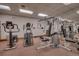 Well-equipped gym featuring various machines and mirrored walls for a complete fitness experience at 62 Broken Lance Dr # 202E, Breckenridge, CO 80424