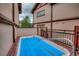 Private outdoor hot tub on a wooden deck, providing a relaxing retreat with privacy walls at 62 Broken Lance Dr # 202E, Breckenridge, CO 80424