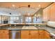 Open-concept kitchen showcasing granite countertops and modern appliances with a view into the living area at 62 Broken Lance Dr # 202E, Breckenridge, CO 80424