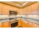 Modern kitchen featuring sleek countertops, stainless steel appliances, and ample cabinetry for storage at 62 Broken Lance Dr # 202E, Breckenridge, CO 80424