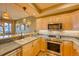 Well-equipped kitchen features stainless steel appliances, granite countertops, and ample storage space at 62 Broken Lance Dr # 202E, Breckenridge, CO 80424