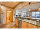 Well-equipped kitchen with stainless steel appliances, granite countertops, and seamless flow into the living areas at 62 Broken Lance Dr # 202E, Breckenridge, CO 80424