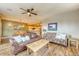 Inviting living room featuring a leather sofa, rustic coffee table, and a view into the adjacent kitchen area at 62 Broken Lance Dr # 202E, Breckenridge, CO 80424