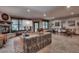 Inviting living room with fireplace, stylish decor, large windows, and comfortable seating arrangement at 62 Broken Lance Dr # 202E, Breckenridge, CO 80424