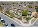 Expansive aerial view of a well-maintained townhome complex featuring lush landscaping and community spaces at 6365 Orion Ct # B, Arvada, CO 80403