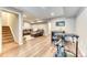 Spacious basement area complete with stairs, a recreation area, and exercise equipment, ideal for entertainment and fitness at 6365 Orion Ct # B, Arvada, CO 80403