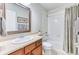 Bathroom with a vanity, a framed mirror, and a shower-tub combo, creating a clean and functional space at 6365 Orion Ct # B, Arvada, CO 80403