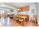 Elegant dining room featuring hardwood floors, a cozy fireplace, and staircase at 6365 Orion Ct # B, Arvada, CO 80403