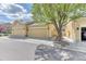 Charming townhome exterior with attached two-car garage and well-maintained landscaping at 6365 Orion Ct # B, Arvada, CO 80403