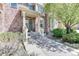 Attractive brick townhome with a welcoming porch, neat landscaping, and a peaceful setting at 6365 Orion Ct # B, Arvada, CO 80403