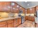 Updated kitchen with ample cabinet space, stainless steel appliances, and granite countertops at 6365 Orion Ct # B, Arvada, CO 80403