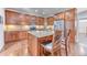 Gourmet kitchen with stainless steel appliances, granite countertops, and a central island with barstool seating at 6365 Orion Ct # B, Arvada, CO 80403