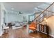 Inviting living room featuring hardwood floors, comfortable seating, natural light, and staircase at 6365 Orion Ct # B, Arvada, CO 80403