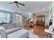 Open living room with hardwood floors, cozy seating, and a staircase leading to the upper level at 6365 Orion Ct # B, Arvada, CO 80403