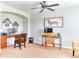 A spacious office is decorated with two wooden desks with views to the interior and exterior of the home at 6365 Orion Ct # B, Arvada, CO 80403