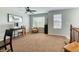 Upper level office with large windows, ceiling fan, and natural light creates a productive work from home environment at 6365 Orion Ct # B, Arvada, CO 80403