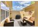 Cozy patio featuring wicker furniture, a grill, and decorative accents, ideal for outdoor relaxation at 6365 Orion Ct # B, Arvada, CO 80403