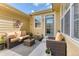 Charming outdoor patio with comfortable seating, plants, and decor, perfect for relaxing or entertaining guests at 6365 Orion Ct # B, Arvada, CO 80403