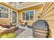 Welcoming patio area showcasing outdoor seating and a grill, perfect for enjoying sunny days at 6365 Orion Ct # B, Arvada, CO 80403