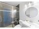 Modern bathroom with a glass-enclosed shower, sleek vanity, and contemporary fixtures at 1459 S Pierce St, Lakewood, CO 80232