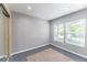 Bright bedroom features neutral walls, hardwood floors, and windows providing natural light at 1459 S Pierce St, Lakewood, CO 80232