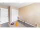 This bedroom features neutral colored walls and a white closet door at 1459 S Pierce St, Lakewood, CO 80232