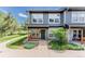 Charming two-story townhouse with a covered front porch and well-maintained landscaping at 1459 S Pierce St, Lakewood, CO 80232