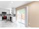 Beautiful kitchen with stainless steel appliances, marble floors, and backyard access at 1459 S Pierce St, Lakewood, CO 80232