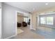 Spacious living room with ample seating, natural light, and carpeted floors at 1459 S Pierce St, Lakewood, CO 80232